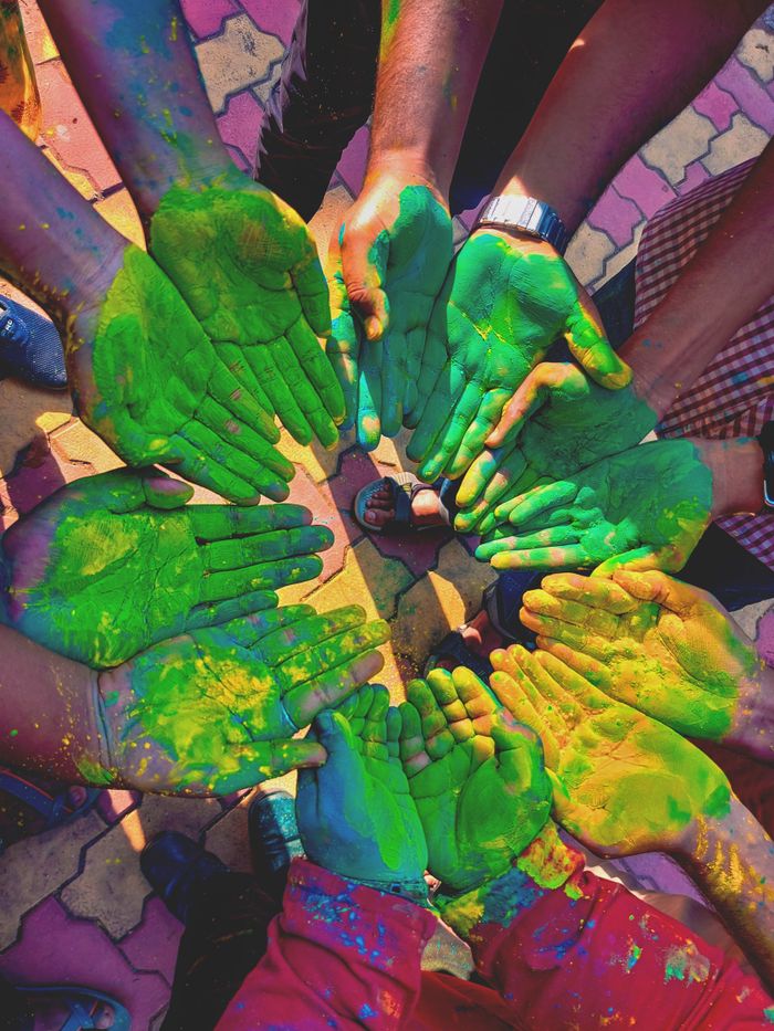 services-01 Vibrant green hands unite in celebration at Holi, symbolizing joy and togetherness.